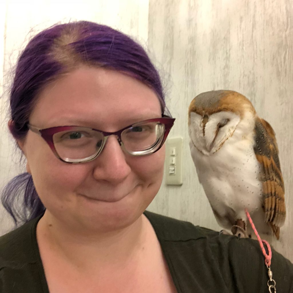 A selfie of me and the barn owl on my shoulder.