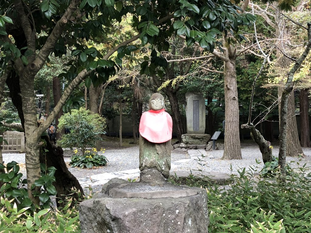 A faded statue of Jizo.