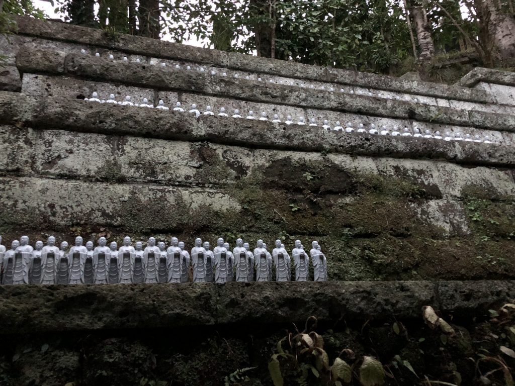 A high up ledge around the rim of the garden. Even this is lined with dozens of tiny statues.