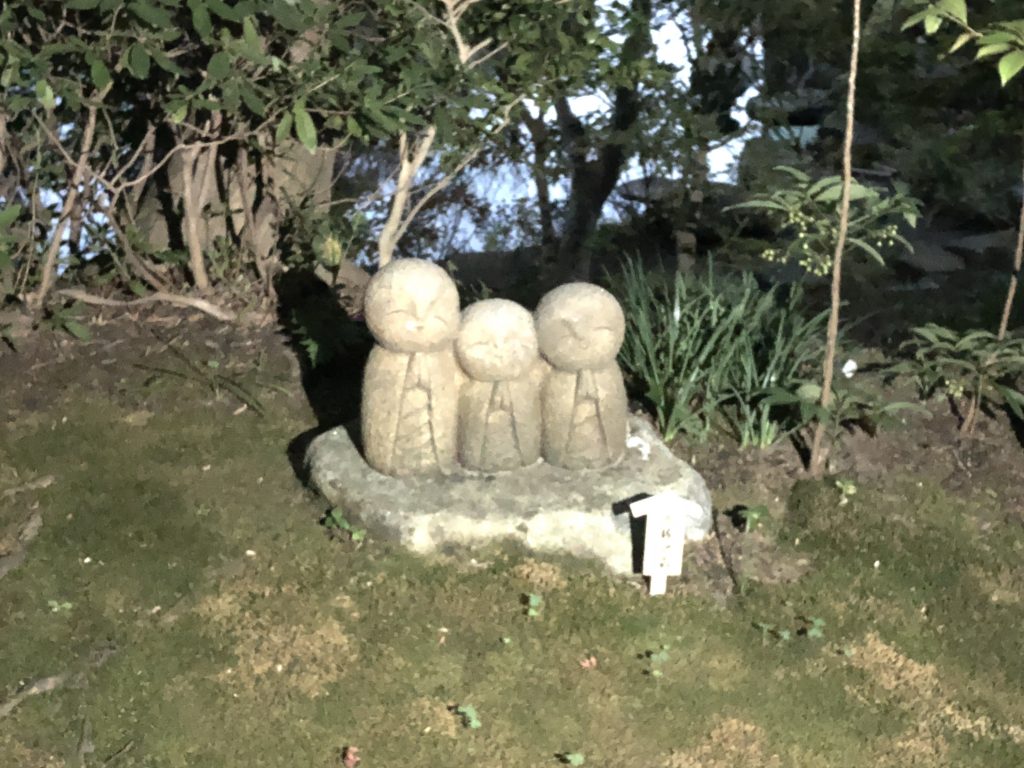 Three little Jizo, similar in style to Nagomi Jizo. The picture is a little blurry due to the lighting.