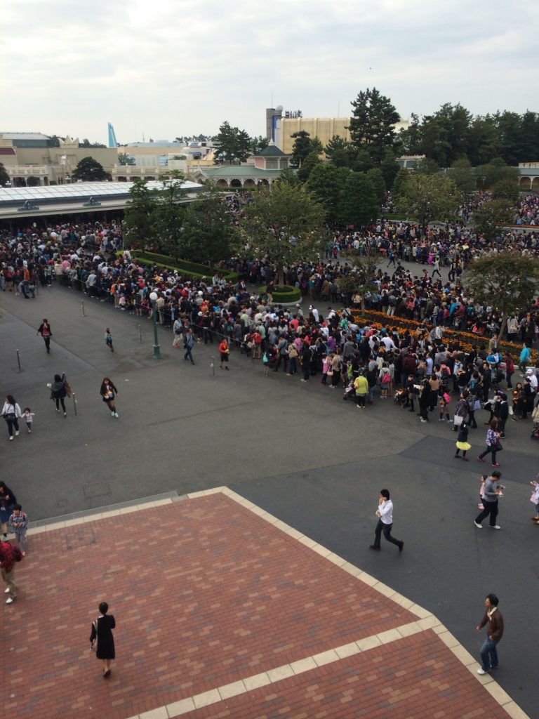 Hundreds of people lined up outside the park waiting to get in.