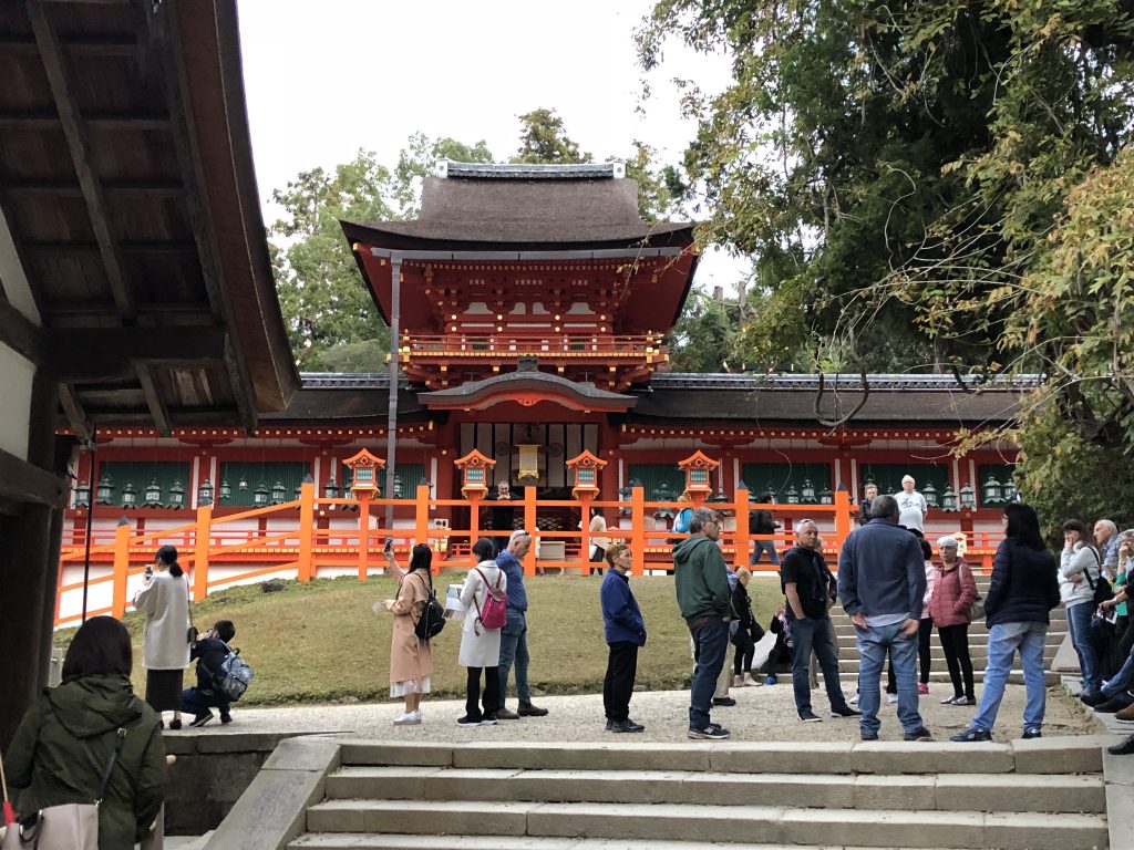 A splendid building with red gates.