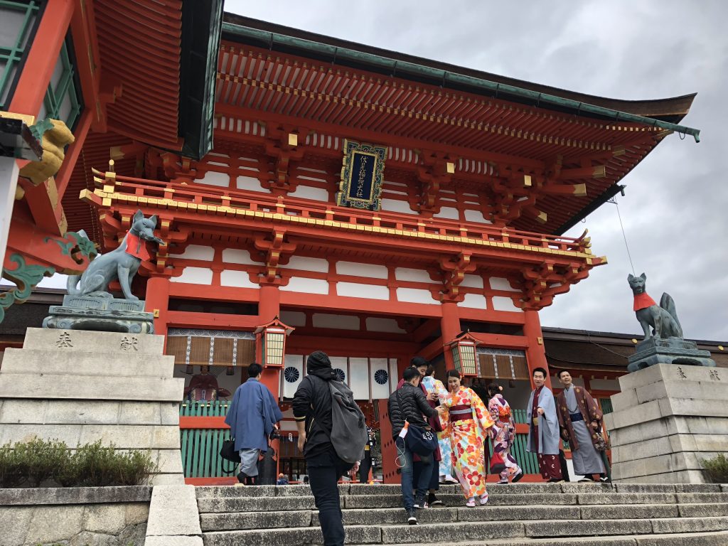 The main building of Fushimi Inari. There are more foxes surrounding it.