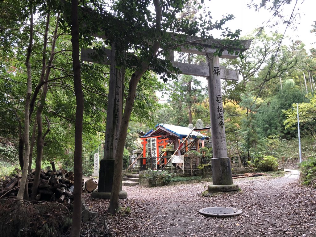 A small shrine with downed poles all over it.